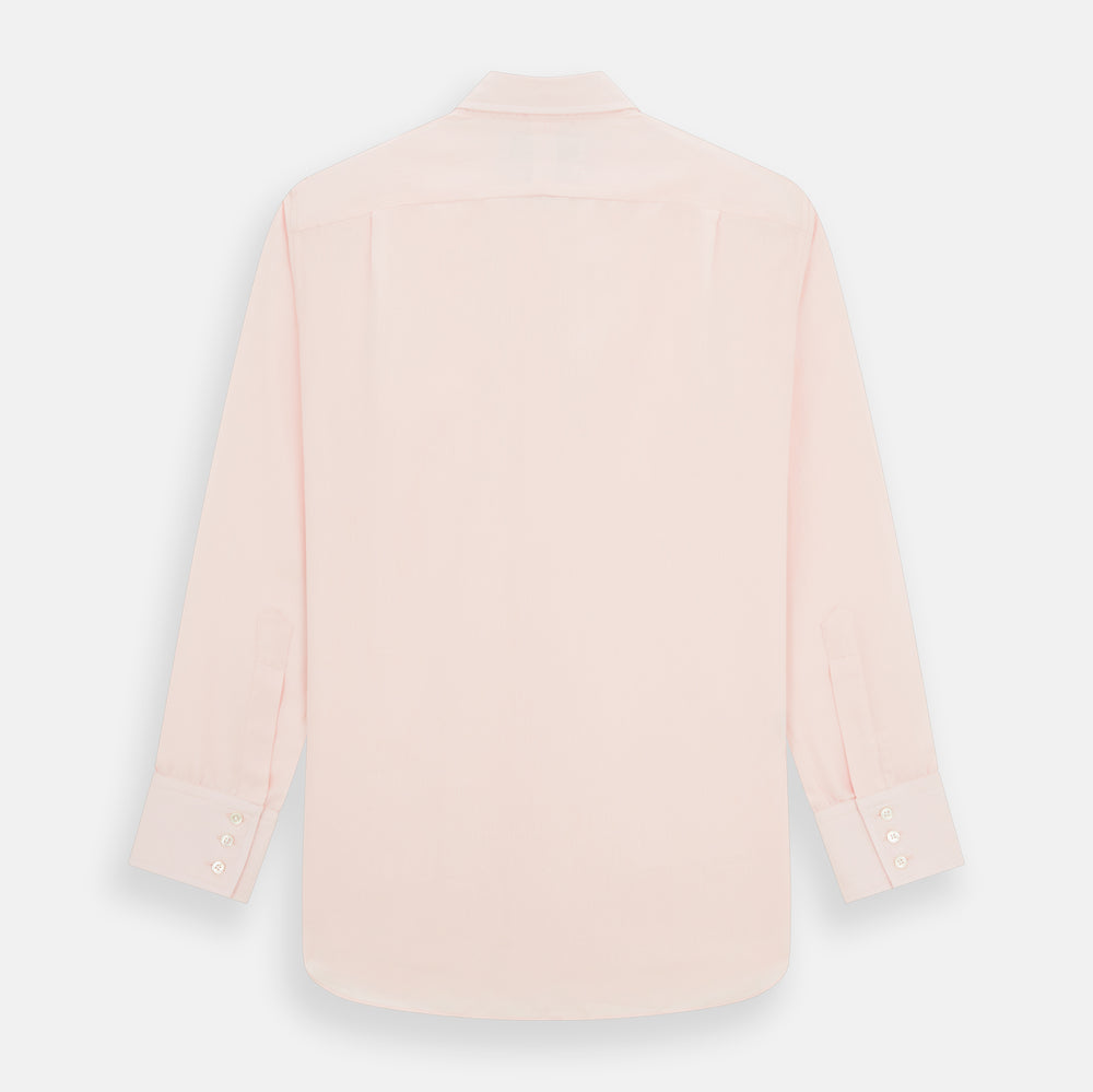 The Turnbull & Asser Pale Pink Cotton Cashmere Chelsea Shirt features long sleeves, a chest pocket, spread collar, and buttoned cuffs. Crafted from a luxurious cotton-cashmere blend, it's shown laid flat on a white background.