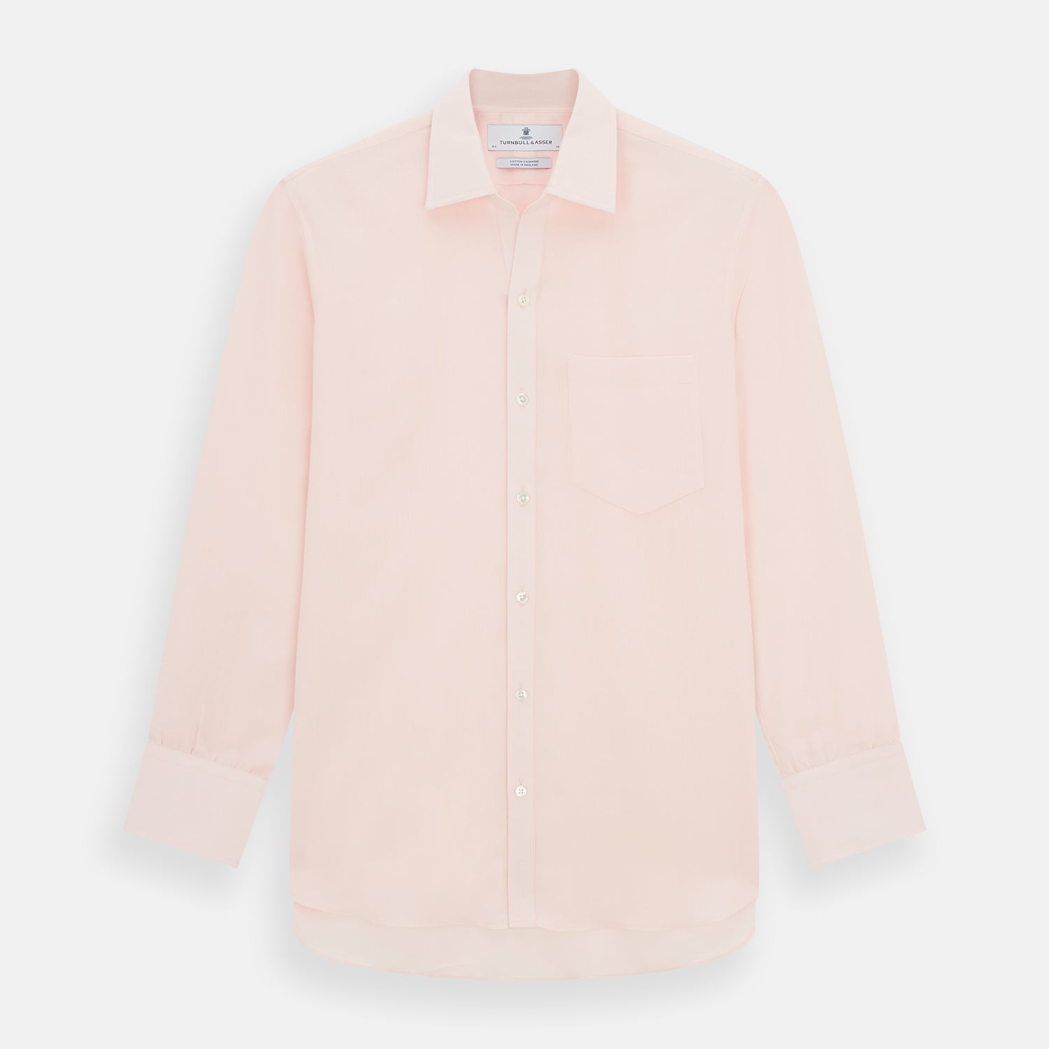 View 1 of product The Turnbull & Asser Pale Pink Cotton Cashmere Chelsea Shirt features long sleeves, a chest pocket, spread collar, and buttoned cuffs. Crafted from a luxurious cotton-cashmere blend, it's shown laid flat on a white background.