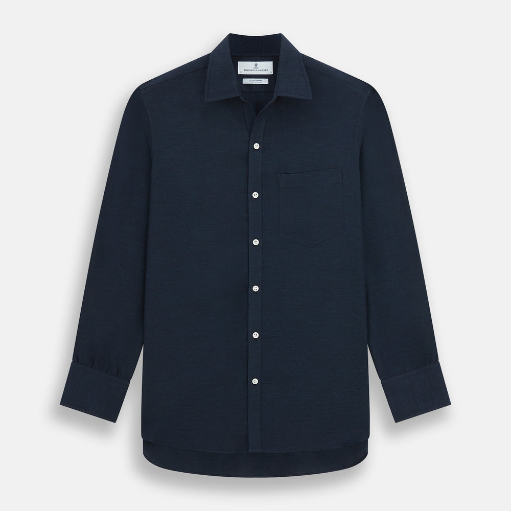 The Turnbull & Asser Navy Cotton Cashmere Chelsea Shirt features long sleeves, a classic collar, front chest pocket, and white buttons, shown laid flat on a white background.