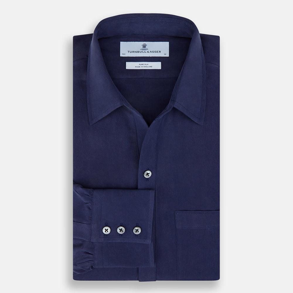 The Navy Silk Chelsea Shirt by Turnbull & Asser features a long sleeve, collar, single chest pocket, and a refined Chelsea fit, displayed against a white background.