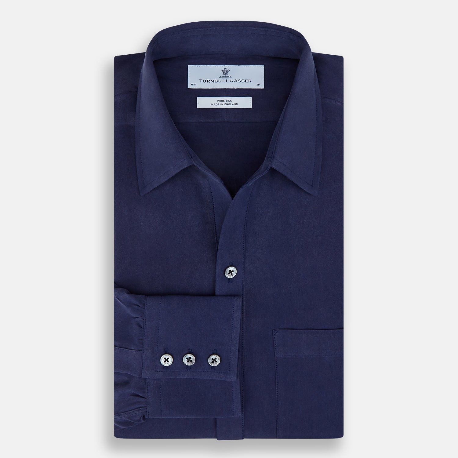 View 5 of product The Navy Silk Chelsea Shirt by Turnbull & Asser features a long sleeve, collar, single chest pocket, and a refined Chelsea fit, displayed against a white background.