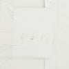 View 4 of product The Turnbull & Asser Cream Silk Chelsea Shirt is an elegant white long-sleeve, button-up silk shirt with a single chest pocket, shown against a plain white background.