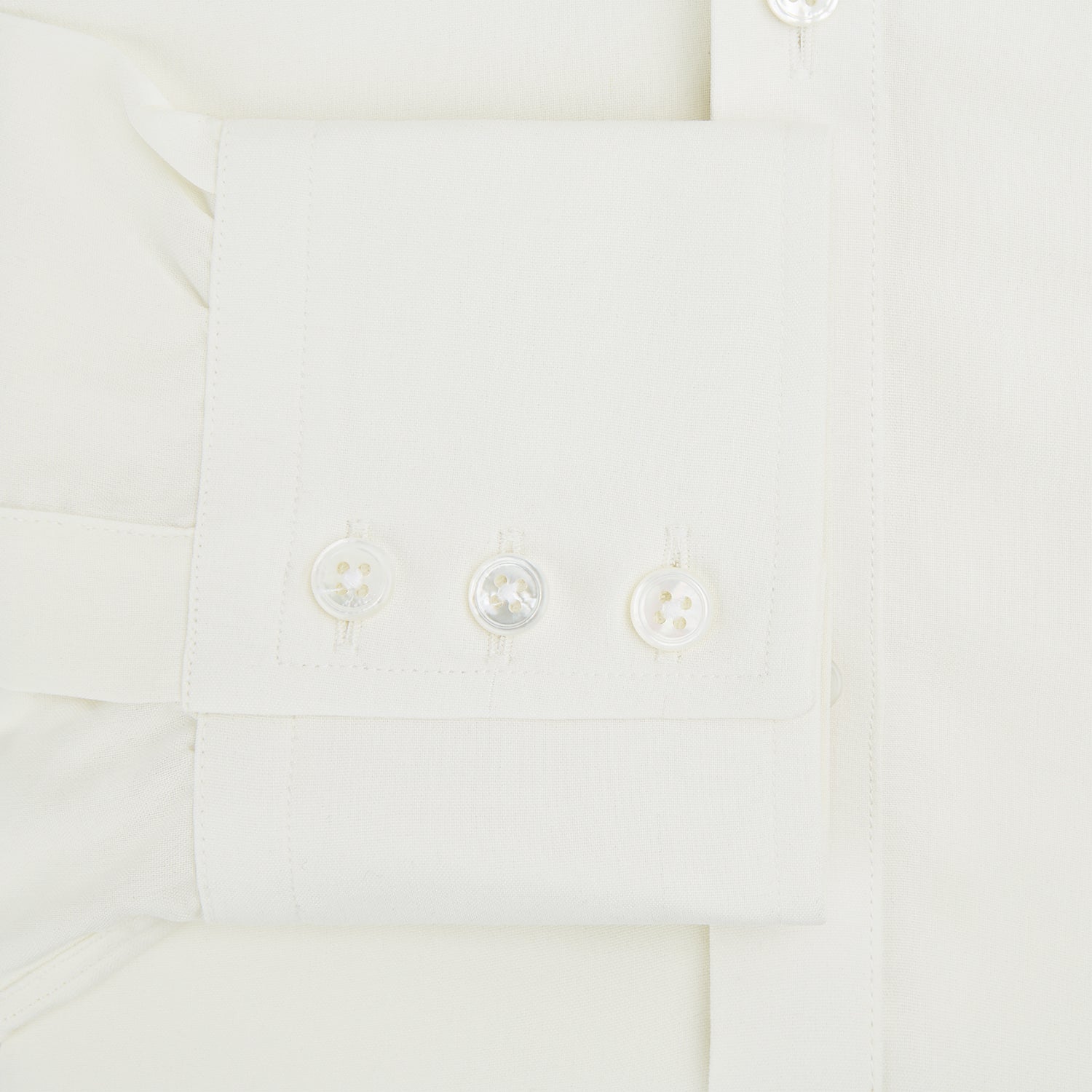 View 4 of product The Turnbull & Asser Cream Silk Chelsea Shirt is an elegant white long-sleeve, button-up silk shirt with a single chest pocket, shown against a plain white background.