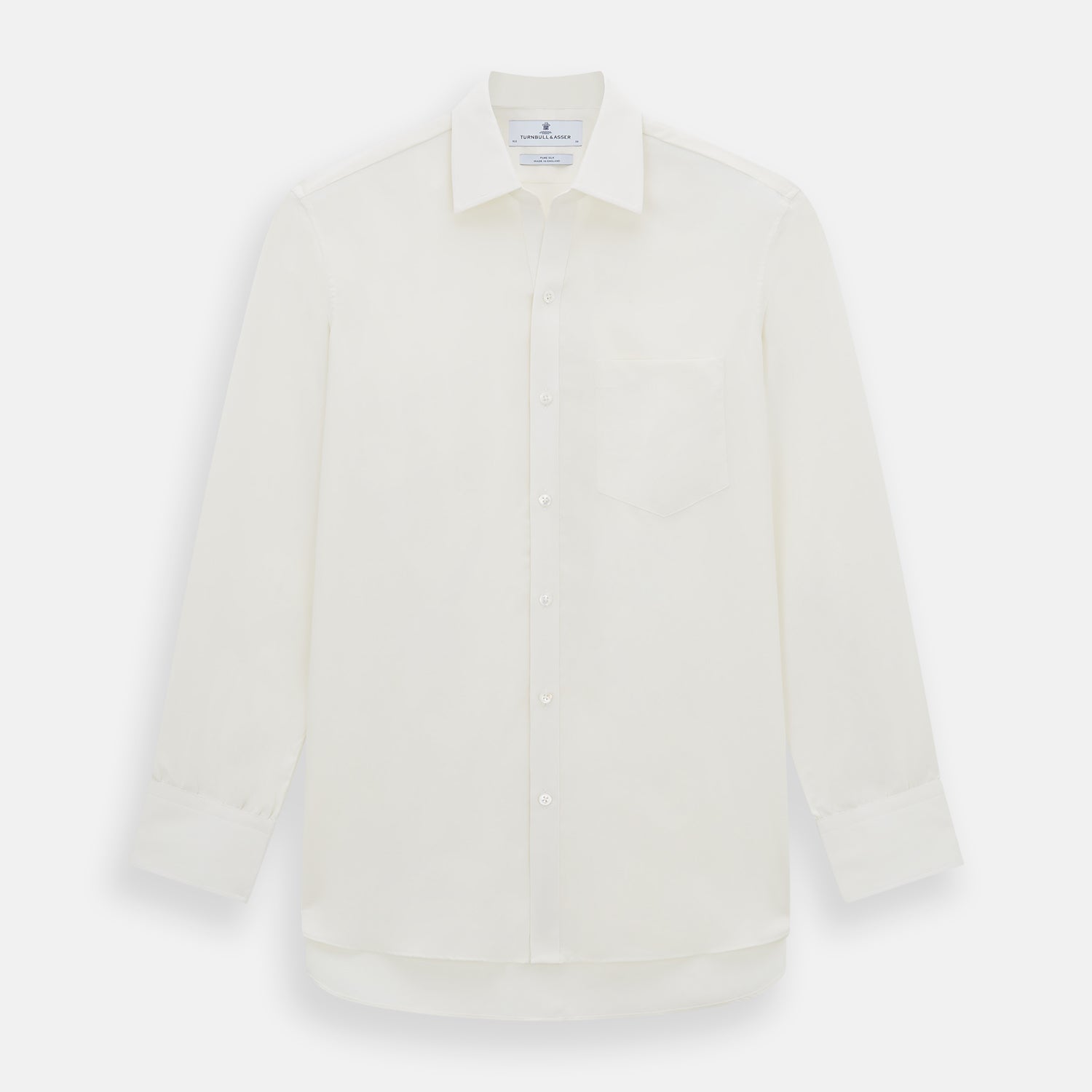 View 1 of product The Turnbull & Asser Cream Silk Chelsea Shirt is an elegant white long-sleeve, button-up silk shirt with a single chest pocket, shown against a plain white background.