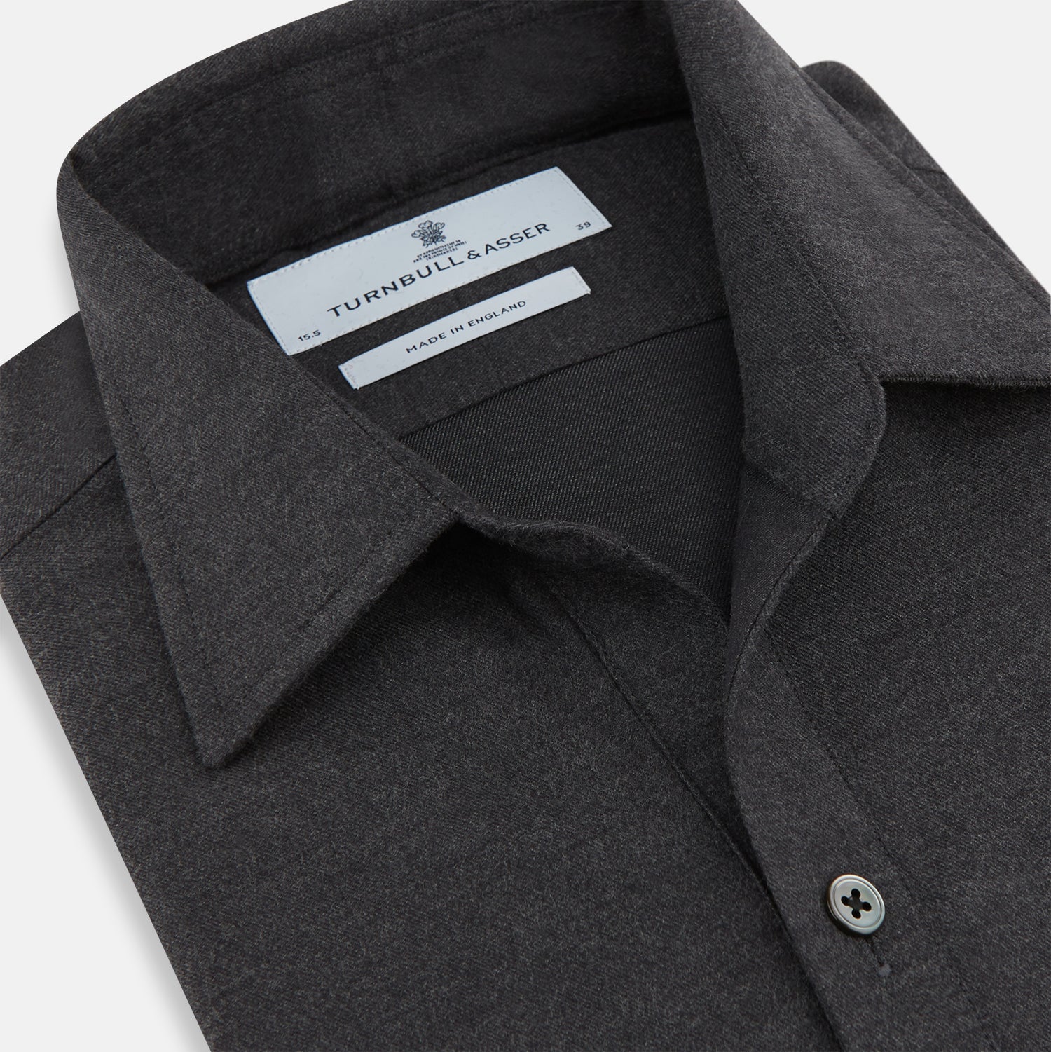 View 2 of product The Charcoal Chelsea Shirt by Turnbull & Asser is a long-sleeve, collared shirt in charcoal gray with a single chest pocket, offering smart-casual style, shown on a plain white background.