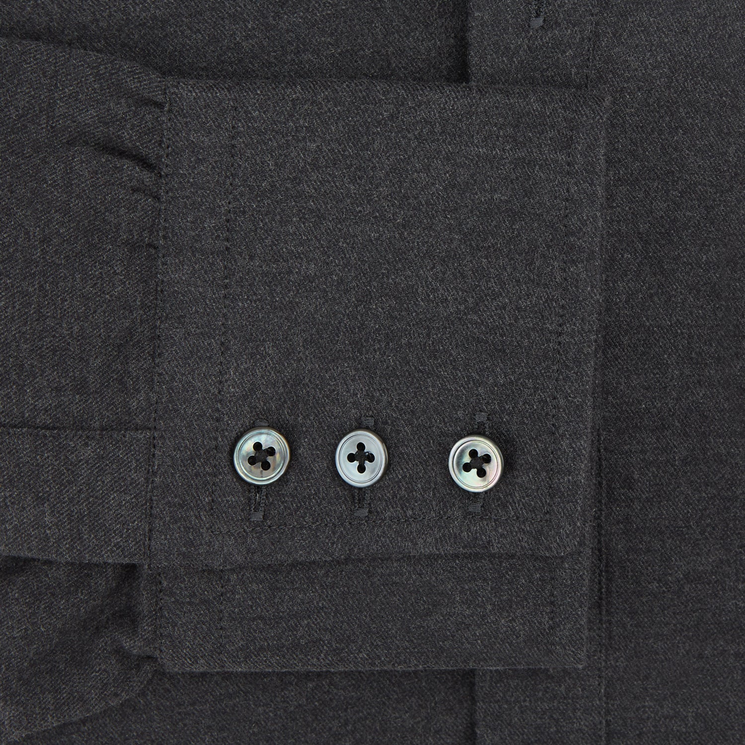View 3 of product The Charcoal Chelsea Shirt by Turnbull & Asser is a long-sleeve, collared shirt in charcoal gray with a single chest pocket, offering smart-casual style, shown on a plain white background.