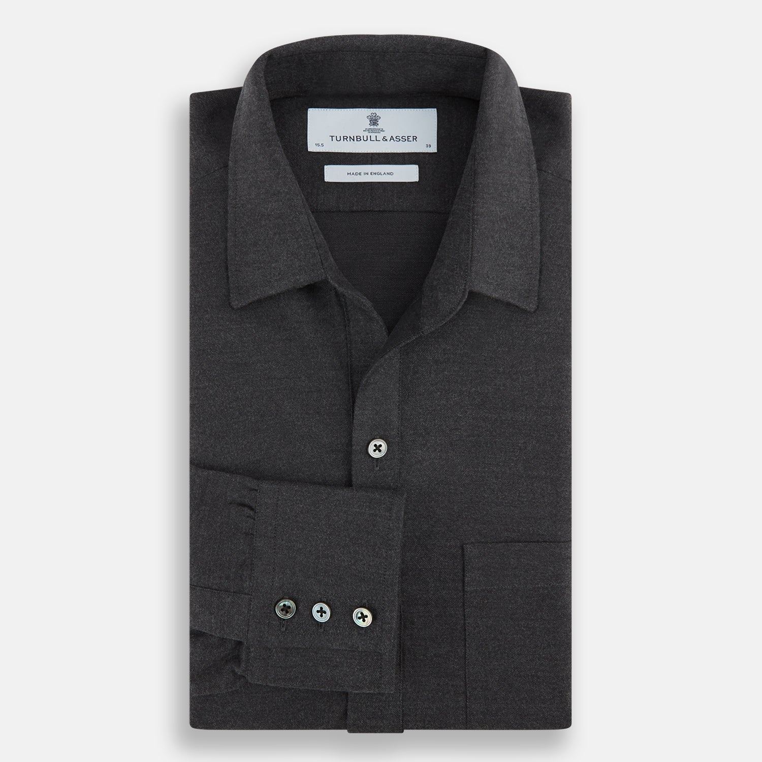 View 4 of product The Charcoal Chelsea Shirt by Turnbull & Asser is a long-sleeve, collared shirt in charcoal gray with a single chest pocket, offering smart-casual style, shown on a plain white background.