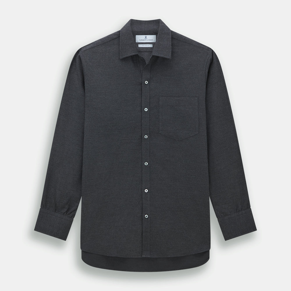The Charcoal Chelsea Shirt by Turnbull & Asser is a long-sleeve, collared shirt in charcoal gray with a single chest pocket, offering smart-casual style, shown on a plain white background.
