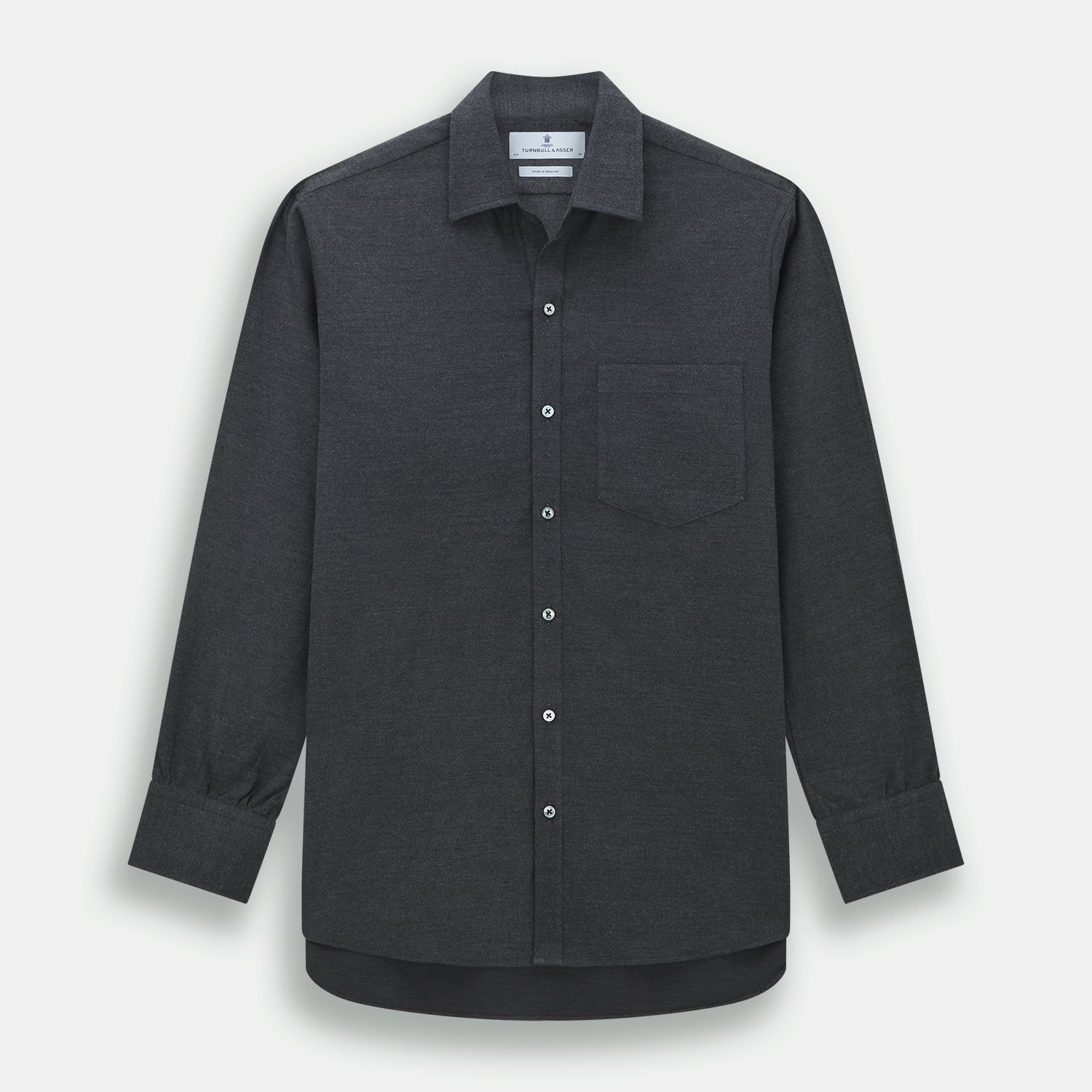 View 1 of product The Charcoal Chelsea Shirt by Turnbull & Asser is a long-sleeve, collared shirt in charcoal gray with a single chest pocket, offering smart-casual style, shown on a plain white background.