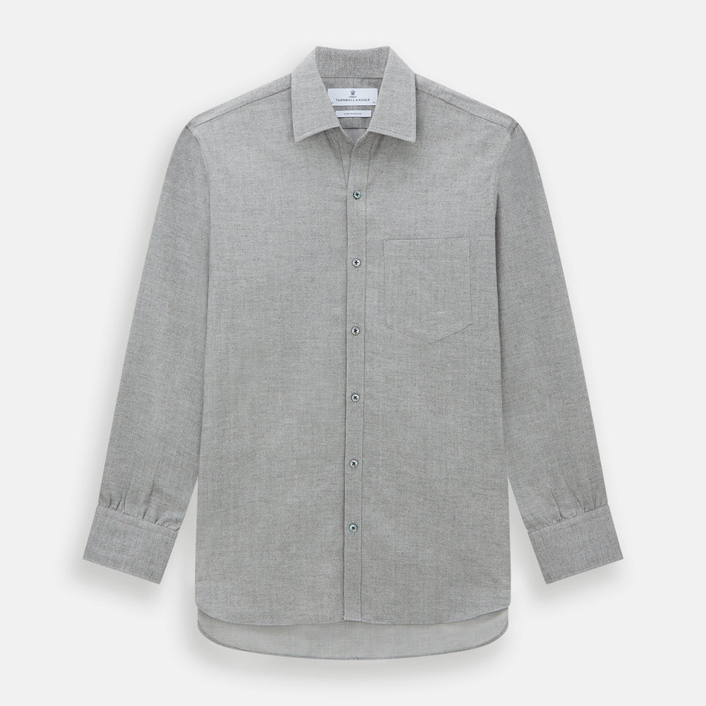 The Turnbull & Asser Grey Herringbone Chelsea Shirt features long sleeves, a chest pocket, classic collar, and buttoned cuffs, adding refined style to smart-casual outfits—shown here against a plain white background.