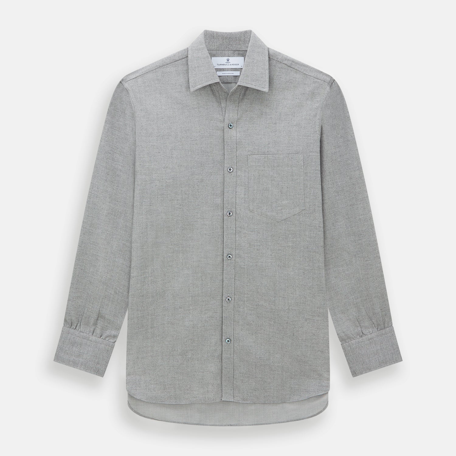 View 1 of product The Turnbull & Asser Grey Herringbone Chelsea Shirt features long sleeves, a chest pocket, classic collar, and buttoned cuffs, adding refined style to smart-casual outfits—shown here against a plain white background.