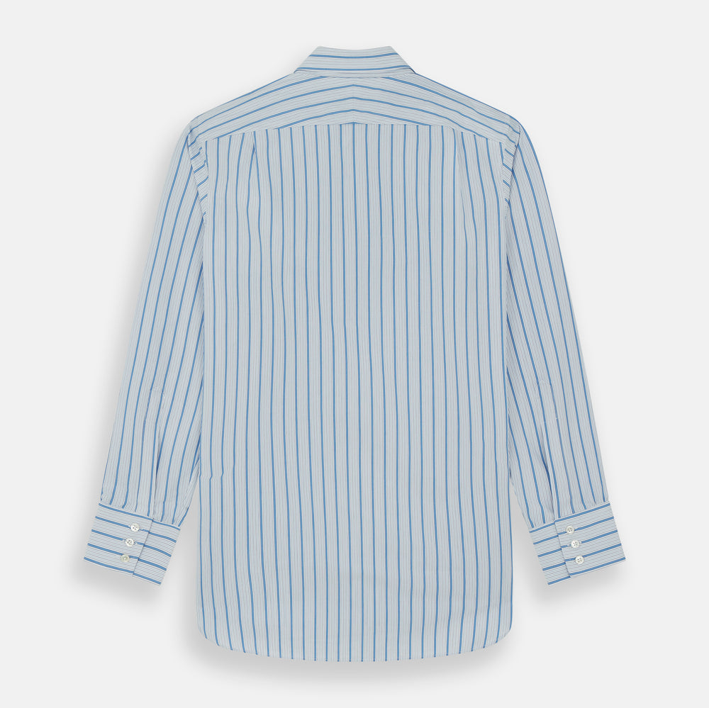The Turnbull & Asser Blue Multi Track Stripe Chelsea Shirt features long sleeves, a light blue multi-stripe design, a chest pocket, open collar, and buttoned cuffs, shown laid flat on a white background.