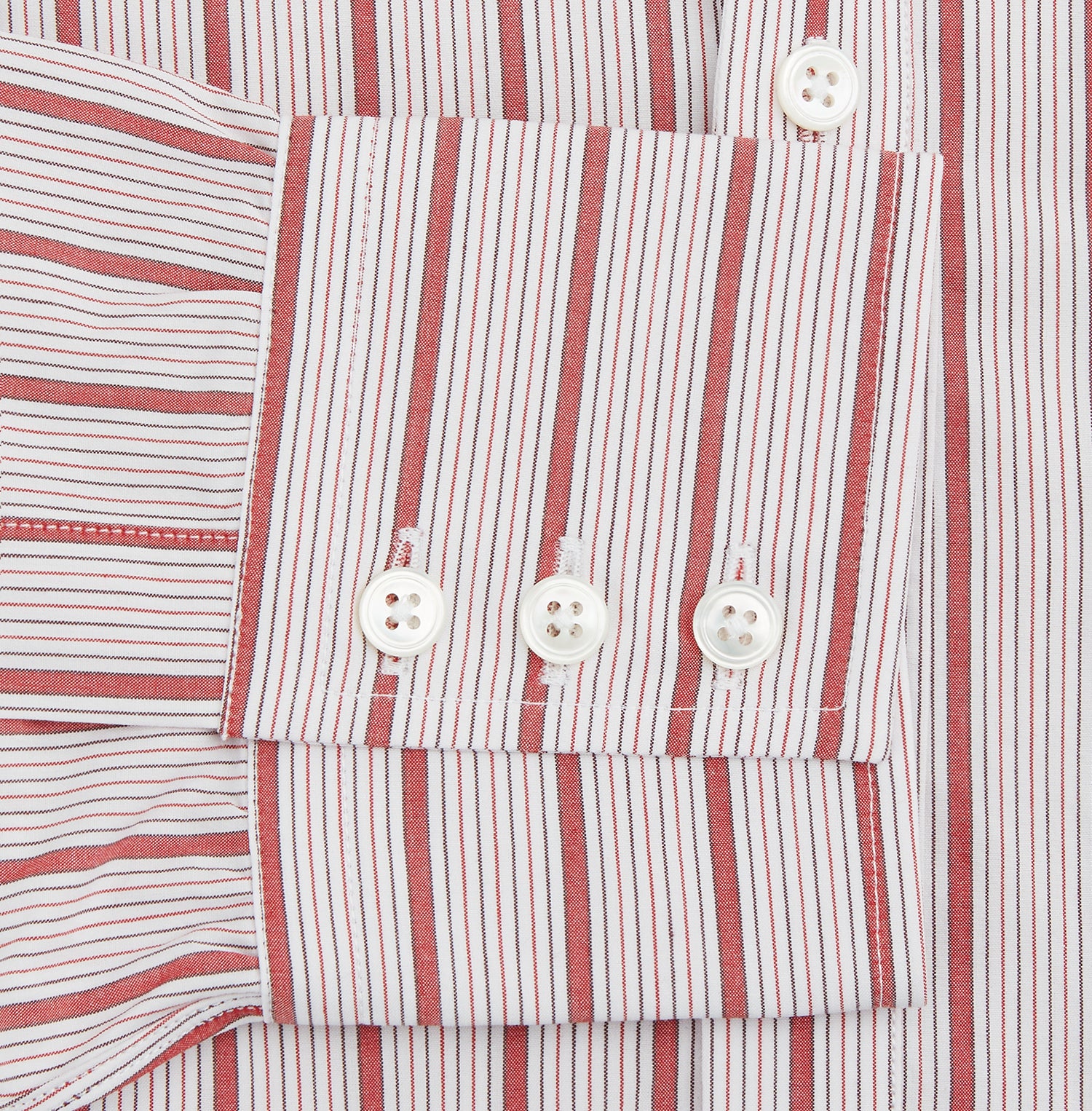 View 3 of product The Turnbull & Asser Red Multi Track Stripe Chelsea Shirt features a classic open collar, long sleeves, red vertical stripes on white, and a left chest pocket—laid flat against a plain background.