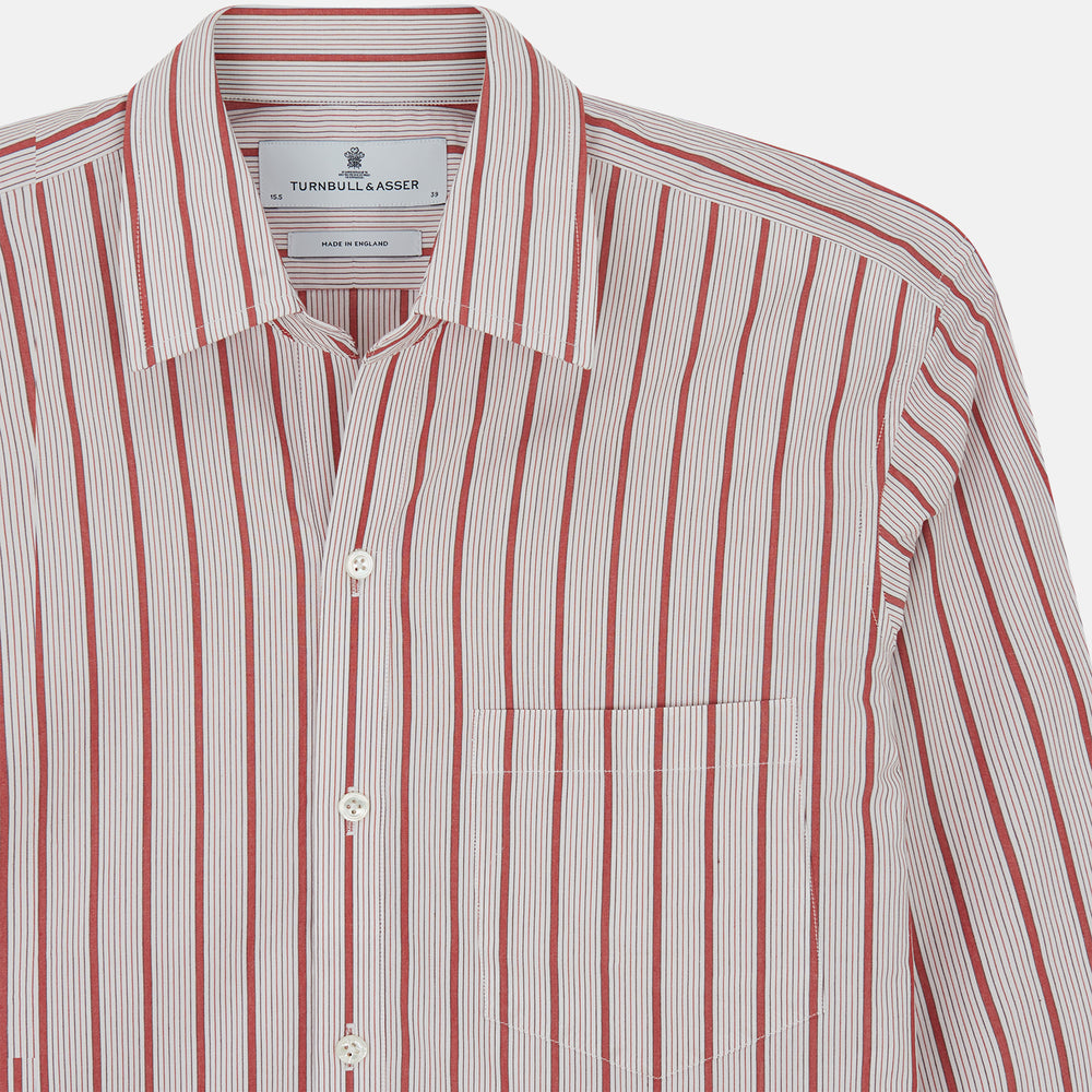 The Turnbull & Asser Red Multi Track Stripe Chelsea Shirt features a classic open collar, long sleeves, red vertical stripes on white, and a left chest pocket—laid flat against a plain background.