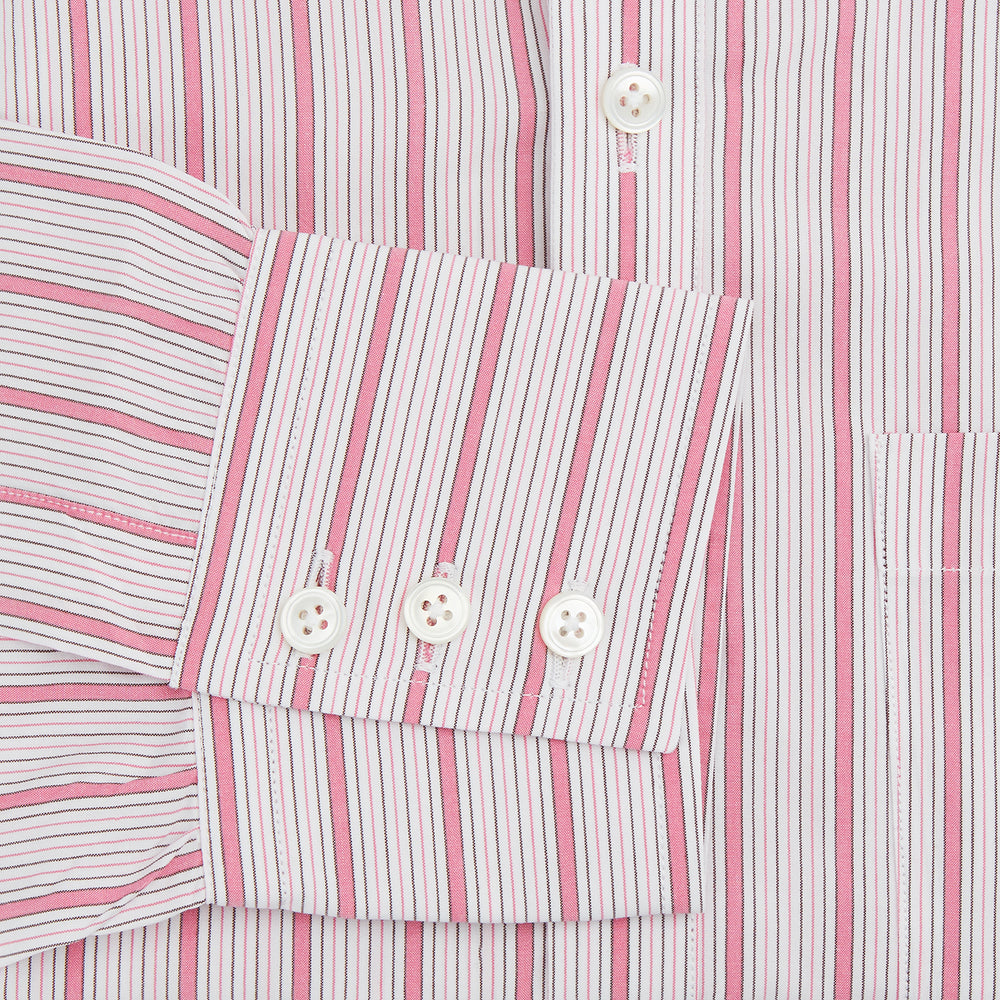 The Turnbull & Asser Pink Multi Track Stripe Chelsea Shirt features long sleeves, an open T&A collar, a left chest pocket, and buttoned cuffs, shown laid flat on a white background.