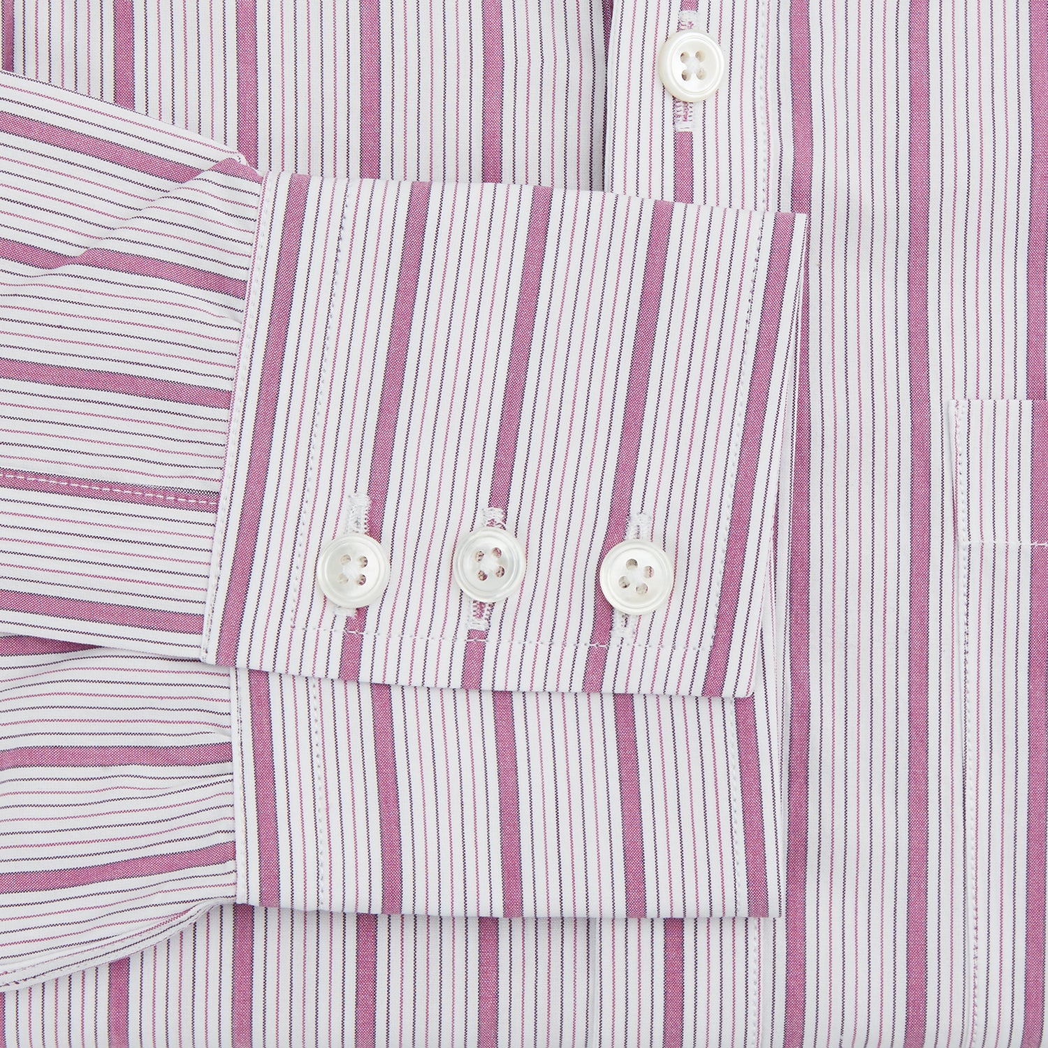 View 3 of product The Purple Multi Track Stripe Chelsea Shirt by Turnbull & Asser features a long-sleeve button-up design with an open Chelsea collar, purple background, vertical multi track stripes, front left pocket, and classic buttoned cuffs.
