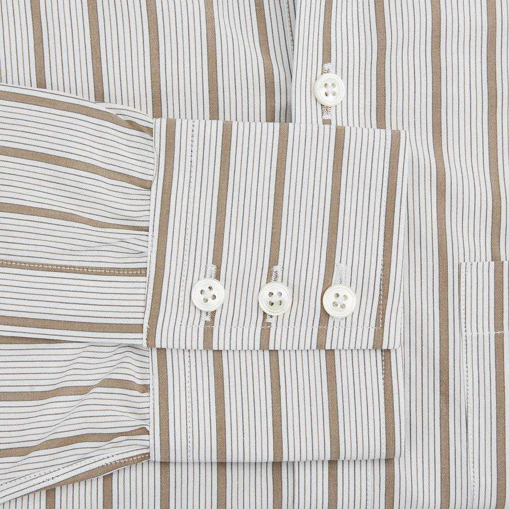 The Turnbull & Asser Brown Multi Track Stripe Chelsea Shirt features long sleeves, multi-track tan stripes, a left chest pocket, and an open T&A collar, shown laid flat on a white background.