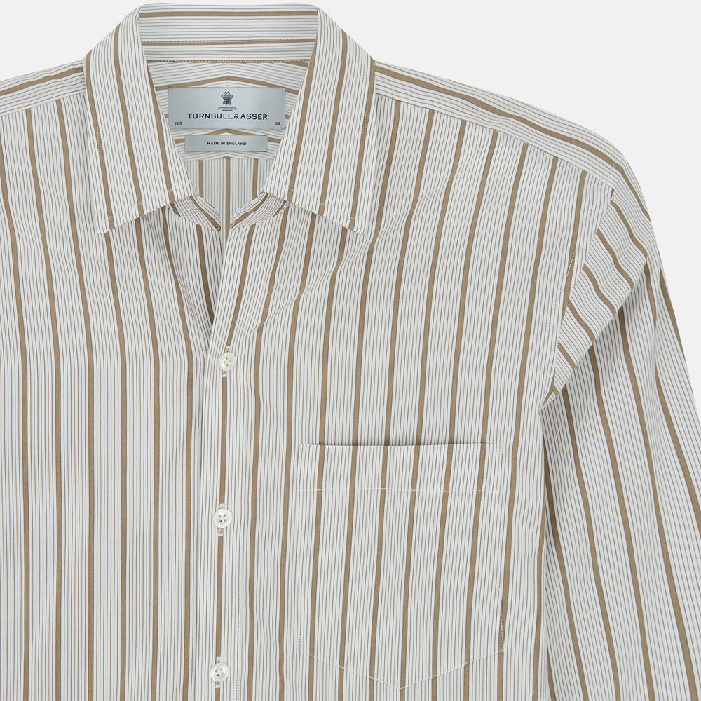 The Turnbull & Asser Brown Multi Track Stripe Chelsea Shirt features long sleeves, multi-track tan stripes, a left chest pocket, and an open T&A collar, shown laid flat on a white background.