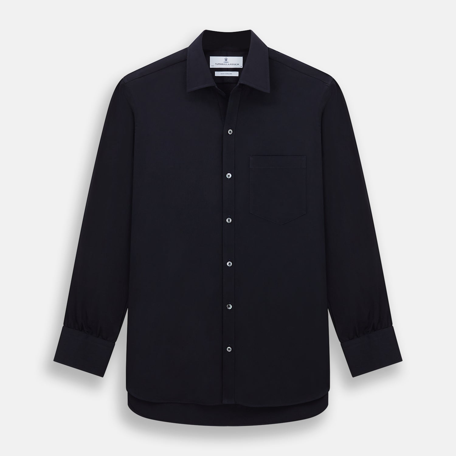 View 1 of product The Turnbull & Asser Navy Twill Chelsea Shirt is a long-sleeve button-up with a collar, front chest pocket, and white buttons, shown against a plain white background.