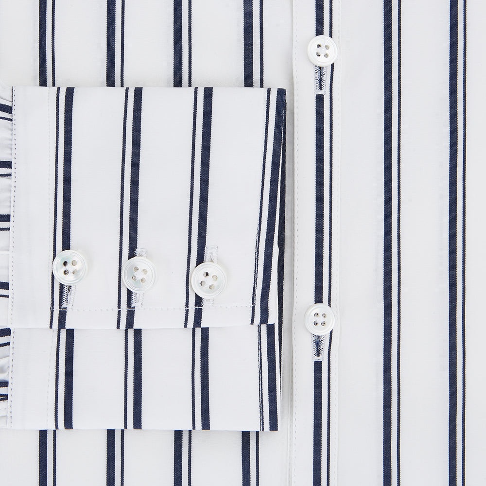 The Turnbull & Asser UK NAVY STRIPED COTTON WESTMINSTER SHIRT features long sleeves, a button-down front, pointed collar, and vertical navy stripes on white for classic British style.