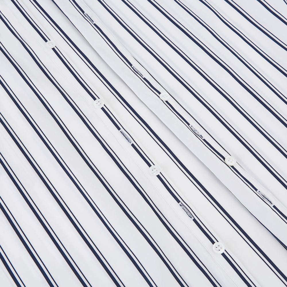 The Turnbull & Asser UK NAVY STRIPED COTTON WESTMINSTER SHIRT features long sleeves, a button-down front, pointed collar, and vertical navy stripes on white for classic British style.