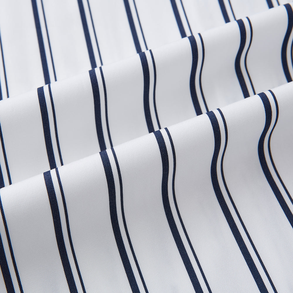 The Turnbull & Asser UK NAVY STRIPED COTTON WESTMINSTER SHIRT features long sleeves, a button-down front, pointed collar, and vertical navy stripes on white for classic British style.