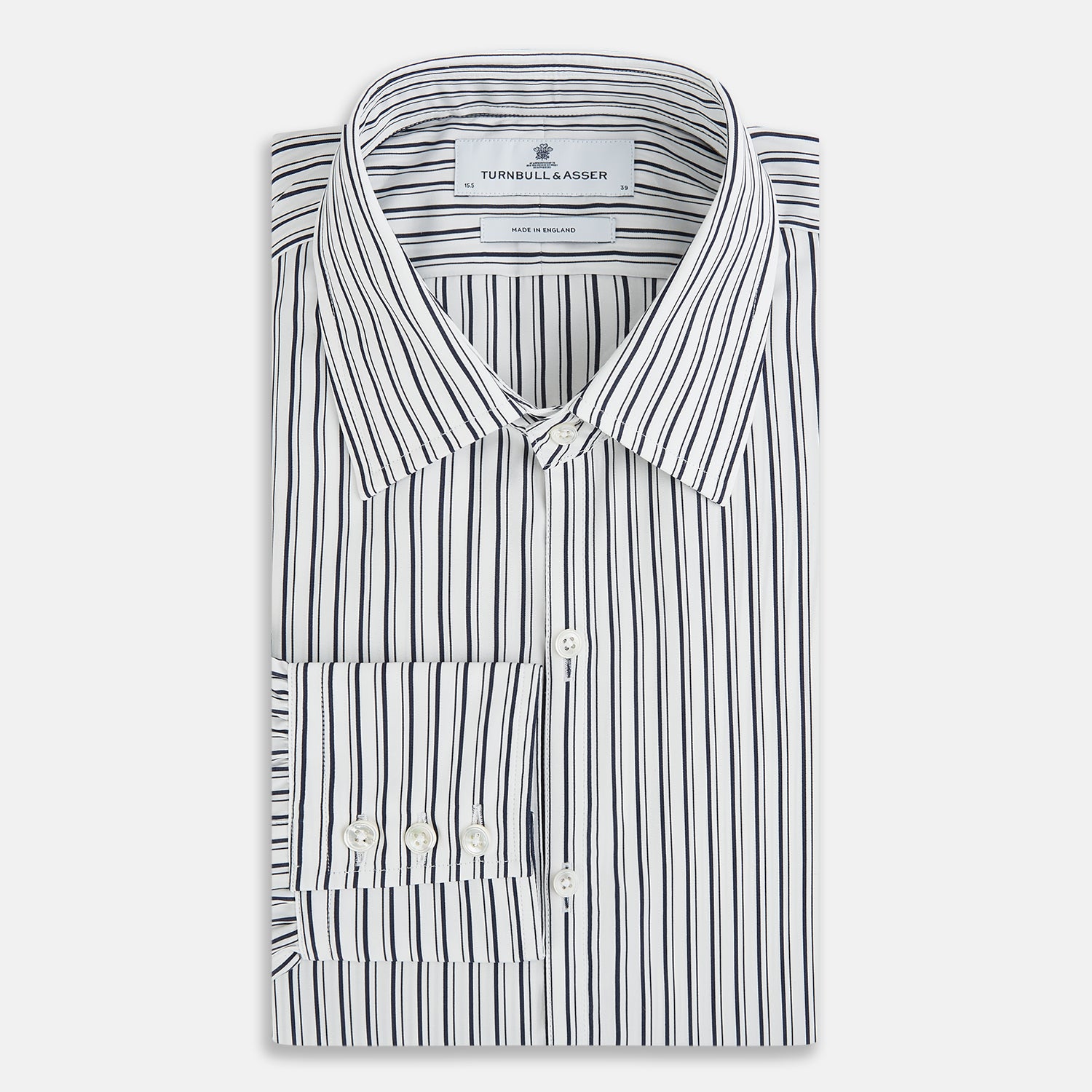 View 5 of product Laid flat on a white background, the Turnbull & Asser UK Westminster White Regular Fit Shirt in Cotton features vertical black and white stripes, a classic collar, buttoned cuffs, and a button-up front—an elegant wardrobe essential that offers timeless style for everyday wear.