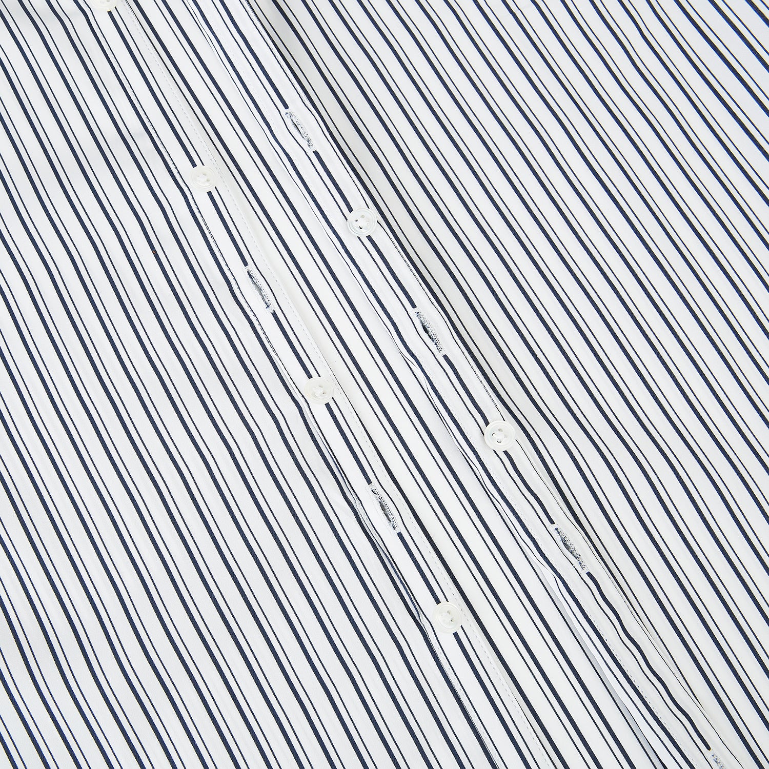 View 7 of product Laid flat on a white background, the Turnbull & Asser UK Westminster White Regular Fit Shirt in Cotton features vertical black and white stripes, a classic collar, buttoned cuffs, and a button-up front—an elegant wardrobe essential that offers timeless style for everyday wear.