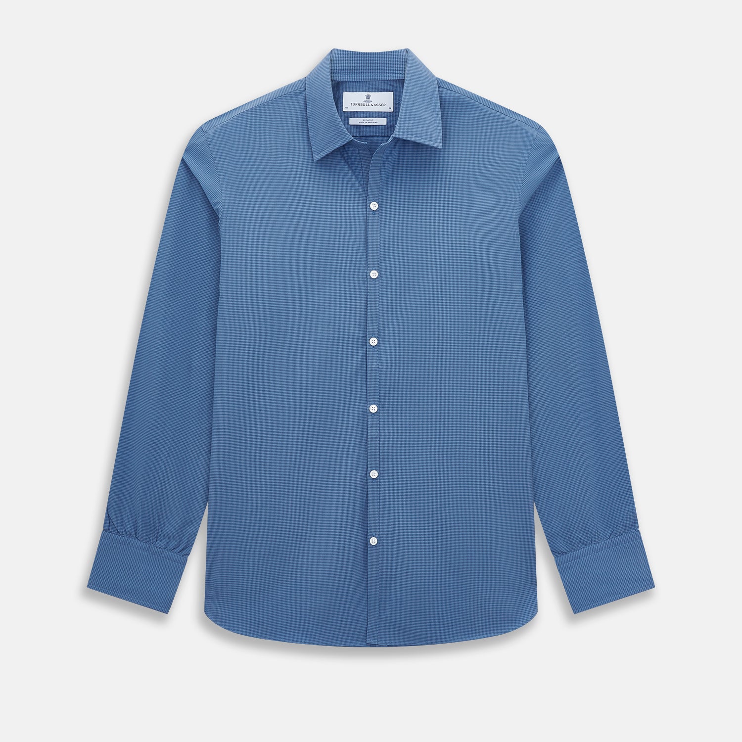 View 1 of product A Colony Blue Pin Check Windsor Shirt by Turnbull & Asser UK, featuring long sleeves, white buttons, a classic Turnbull collar, and buttoned cuffs—expertly crafted in Britain and displayed flat on a white background.
