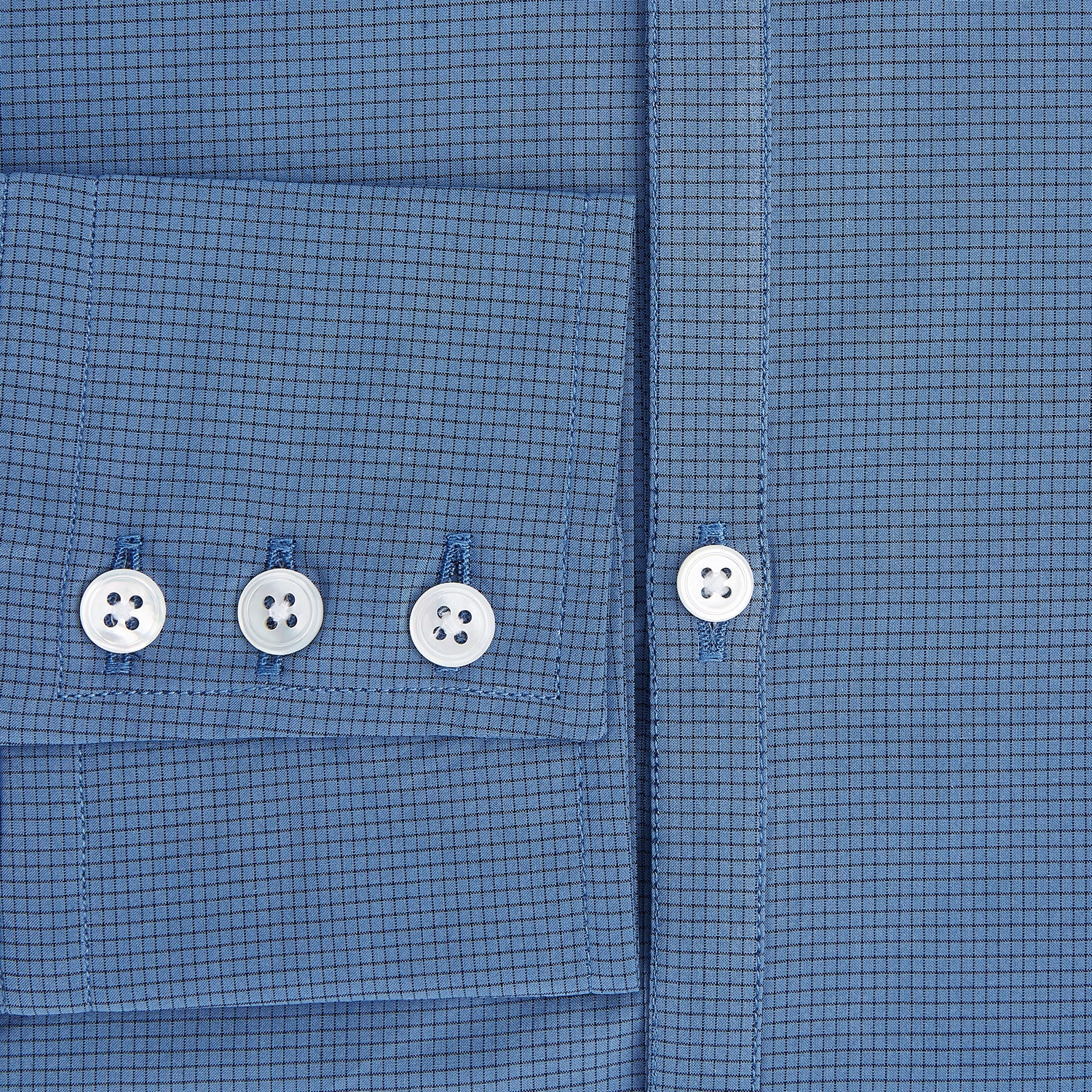 View 4 of product A Colony Blue Pin Check Windsor Shirt by Turnbull & Asser UK, featuring long sleeves, white buttons, a classic Turnbull collar, and buttoned cuffs—expertly crafted in Britain and displayed flat on a white background.