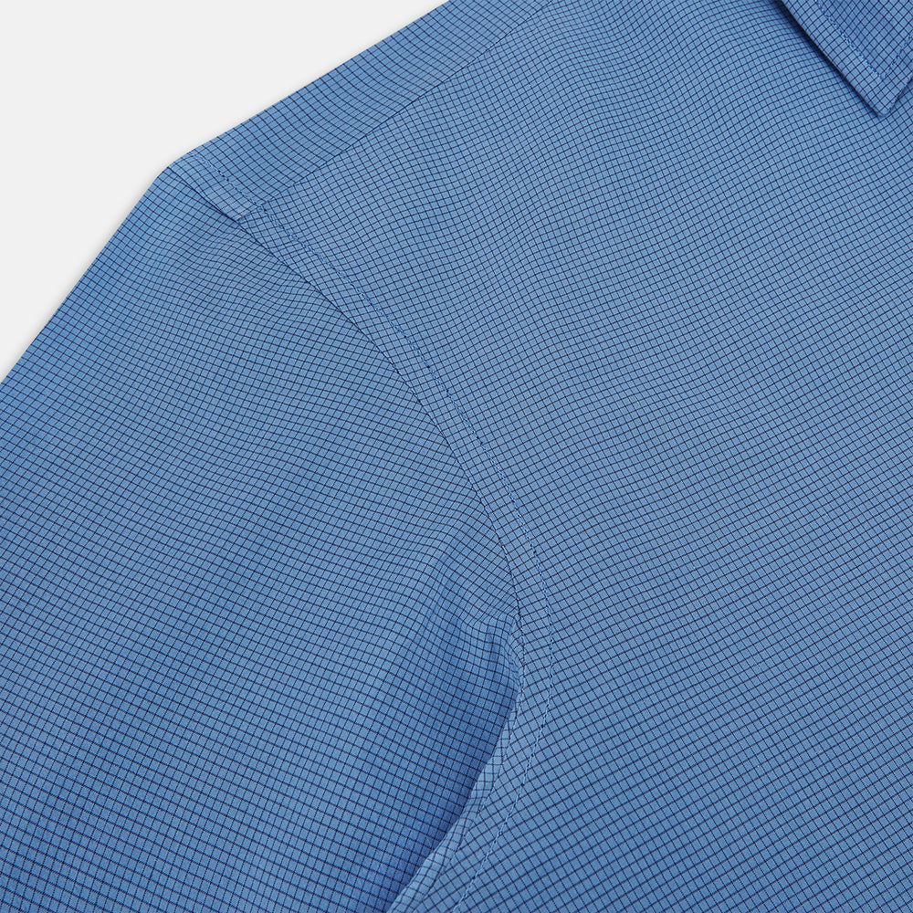 A Colony Blue Pin Check Windsor Shirt by Turnbull & Asser UK, featuring long sleeves, white buttons, a classic Turnbull collar, and buttoned cuffs—expertly crafted in Britain and displayed flat on a white background.