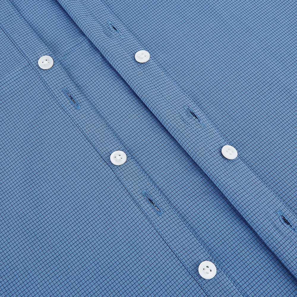 A Colony Blue Pin Check Windsor Shirt by Turnbull & Asser UK, featuring long sleeves, white buttons, a classic Turnbull collar, and buttoned cuffs—expertly crafted in Britain and displayed flat on a white background.