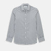 View 1 of product A Chequered Navy on White Windsor Regular Fit Shirt in Cotton by Turnbull & Asser UK, featuring long sleeves, a classic collar, buttoned cuffs, and a navy and white windowpane check pattern, displayed on a white background.