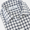 View 2 of product A Chequered Navy on White Windsor Regular Fit Shirt in Cotton by Turnbull & Asser UK, featuring long sleeves, a classic collar, buttoned cuffs, and a navy and white windowpane check pattern, displayed on a white background.