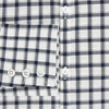 View 3 of product A Chequered Navy on White Windsor Regular Fit Shirt in Cotton by Turnbull & Asser UK, featuring long sleeves, a classic collar, buttoned cuffs, and a navy and white windowpane check pattern, displayed on a white background.