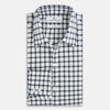 View 4 of product A Chequered Navy on White Windsor Regular Fit Shirt in Cotton by Turnbull & Asser UK, featuring long sleeves, a classic collar, buttoned cuffs, and a navy and white windowpane check pattern, displayed on a white background.