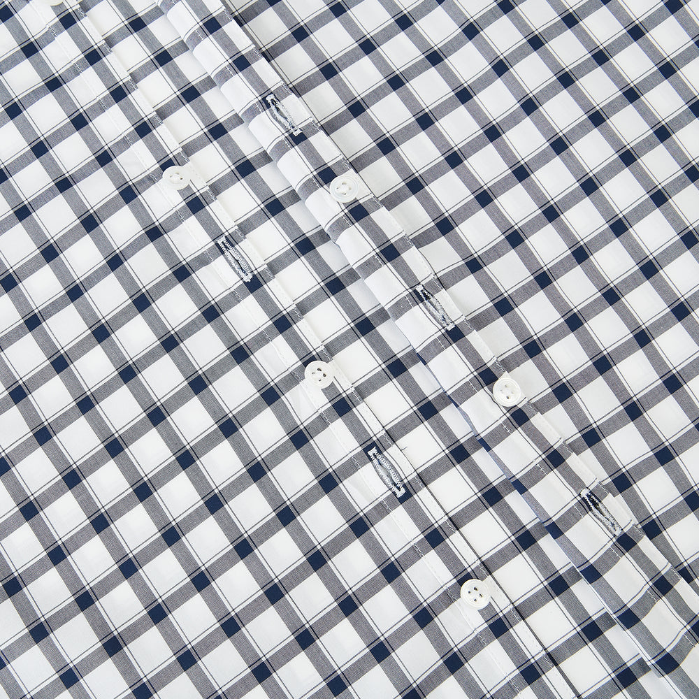 A Chequered Navy on White Windsor Regular Fit Shirt in Cotton by Turnbull & Asser UK, featuring long sleeves, a classic collar, buttoned cuffs, and a navy and white windowpane check pattern, displayed on a white background.