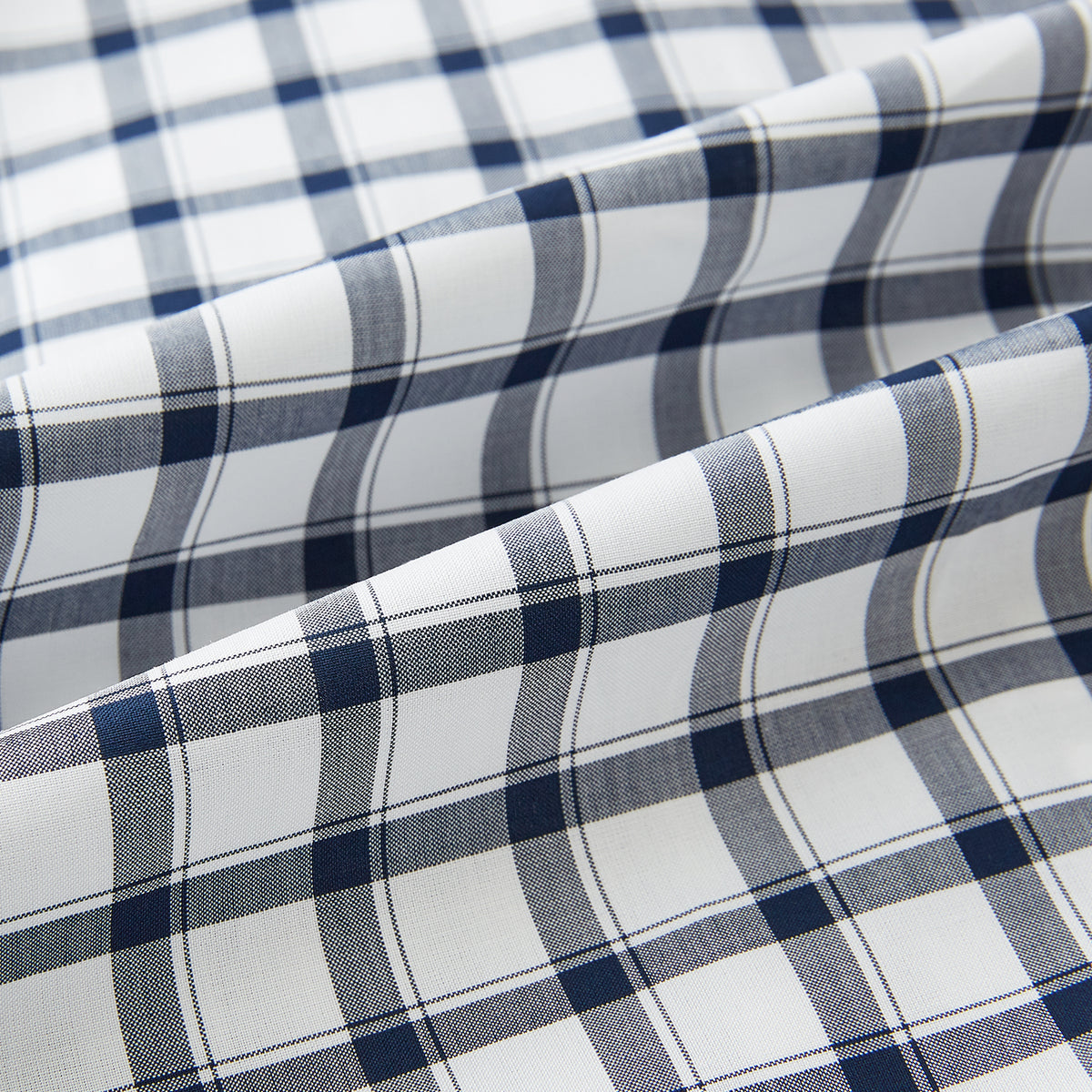 View 7 of product A Chequered Navy on White Windsor Regular Fit Shirt in Cotton by Turnbull & Asser UK, featuring long sleeves, a classic collar, buttoned cuffs, and a navy and white windowpane check pattern, displayed on a white background.