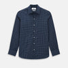 View 1 of product The Turnbull & Asser UK Windsor Navy Regular Fit Shirt in Cotton is a classic men's long-sleeve, button-up shirt featuring a navy blue base with a white grid pattern, displayed laid flat on a white background.