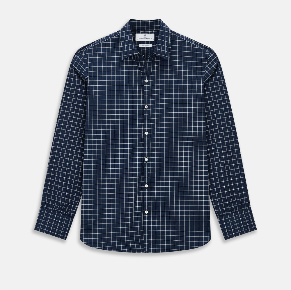 The Turnbull & Asser UK Windsor Navy Regular Fit Shirt in Cotton is a classic men's long-sleeve, button-up shirt featuring a navy blue base with a white grid pattern, displayed laid flat on a white background.