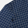 View 6 of product The Turnbull & Asser UK Windsor Navy Regular Fit Shirt in Cotton is a classic men's long-sleeve, button-up shirt featuring a navy blue base with a white grid pattern, displayed laid flat on a white background.