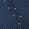 View 7 of product The Turnbull & Asser UK Windsor Navy Regular Fit Shirt in Cotton is a classic men's long-sleeve, button-up shirt featuring a navy blue base with a white grid pattern, displayed laid flat on a white background.