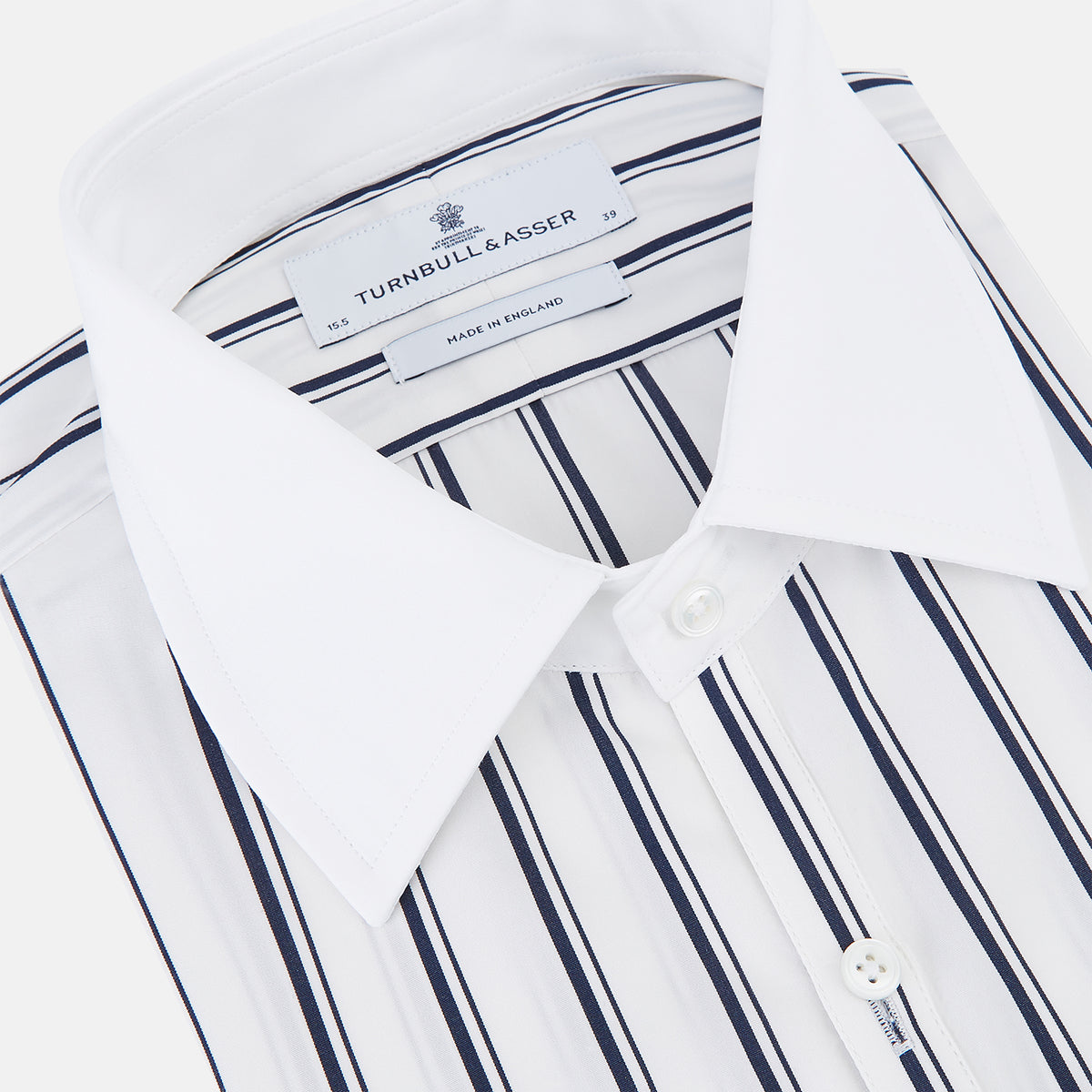 View 2 of product Turnbull & Asser UK Westminster Double Stripe White Closed Collar Regular Fit Shirt in Cotton, a long-sleeve shirt with a white collar and cuffs featuring a vertical black stripe pattern on a white background that evokes British heritage.
