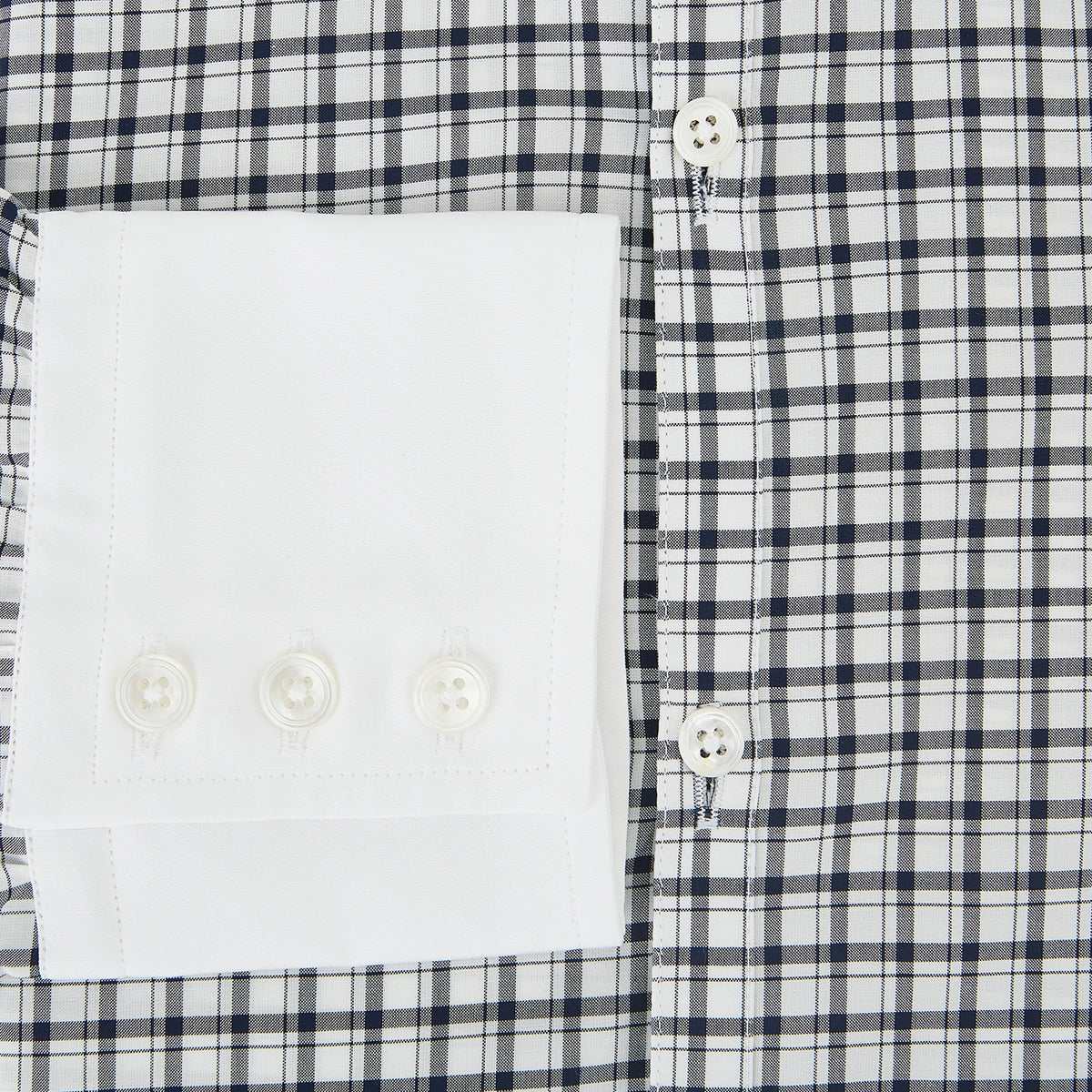 View 4 of product Turnbull & Asser UK Westminster Double-Track Check Navy Closed Collar Regular Fit Shirt in Cotton featuring a long-sleeve button-up design in a navy and white check pattern, complete with a white collar and white cuffs.