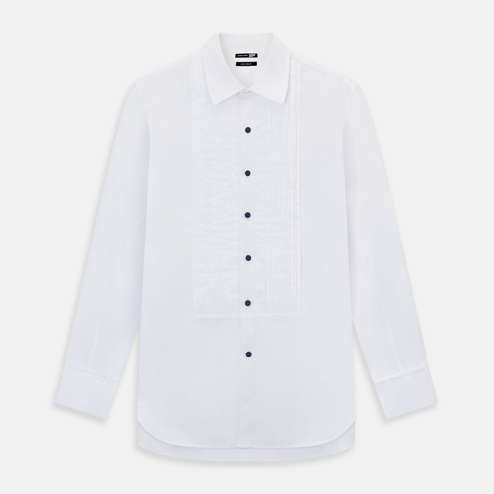 The Casino Royale White Dress Shirt in Cotton by Turnbull & Asser UK is a long-sleeve white dress shirt, crafted from crisp white cotton poplin with a pleated bib front, black buttons, and a classic collar, shown laid flat on a white background.