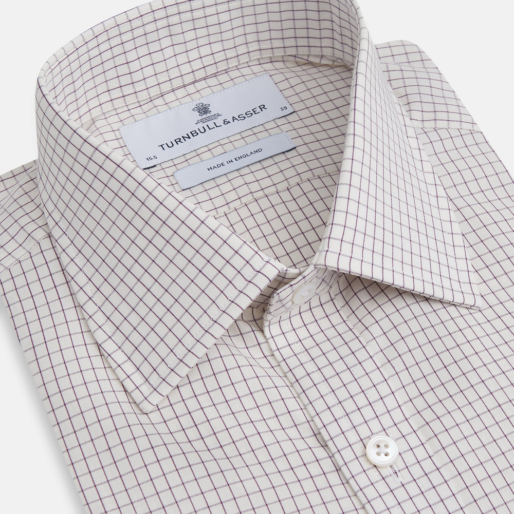 The Turnbull & Asser Purple Graph Check Mayfair Shirt features a classic T&A collar and cuffs, long sleeves, and a subtle purple checkered pattern, shown against a white background.