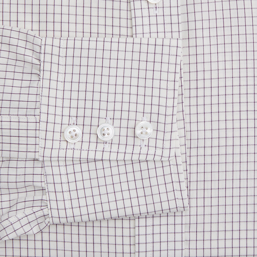 The Turnbull & Asser Purple Graph Check Mayfair Shirt features a classic T&A collar and cuffs, long sleeves, and a subtle purple checkered pattern, shown against a white background.