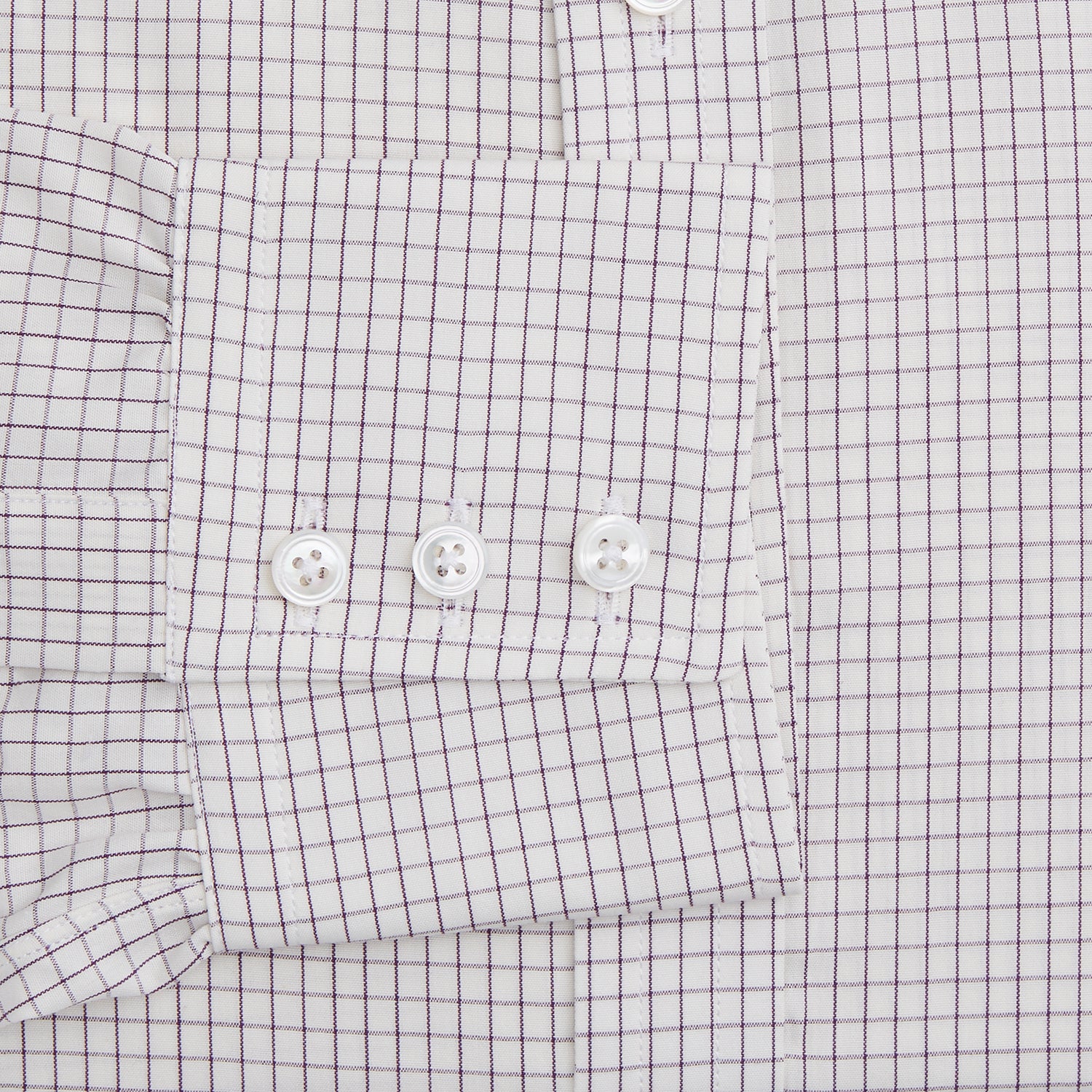 View 3 of product The Turnbull & Asser Purple Graph Check Mayfair Shirt features a classic T&A collar and cuffs, long sleeves, and a subtle purple checkered pattern, shown against a white background.