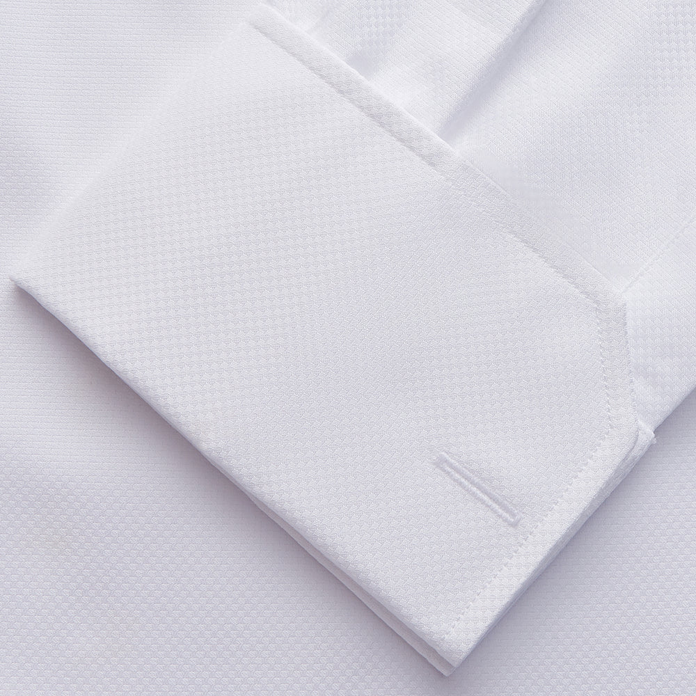 The Turnbull & Asser White Tailored Fit Dress Shirt, featuring a classic collar and button cuffs, is neatly displayed against a white background—perfect as a black tie shirt for formal occasions.