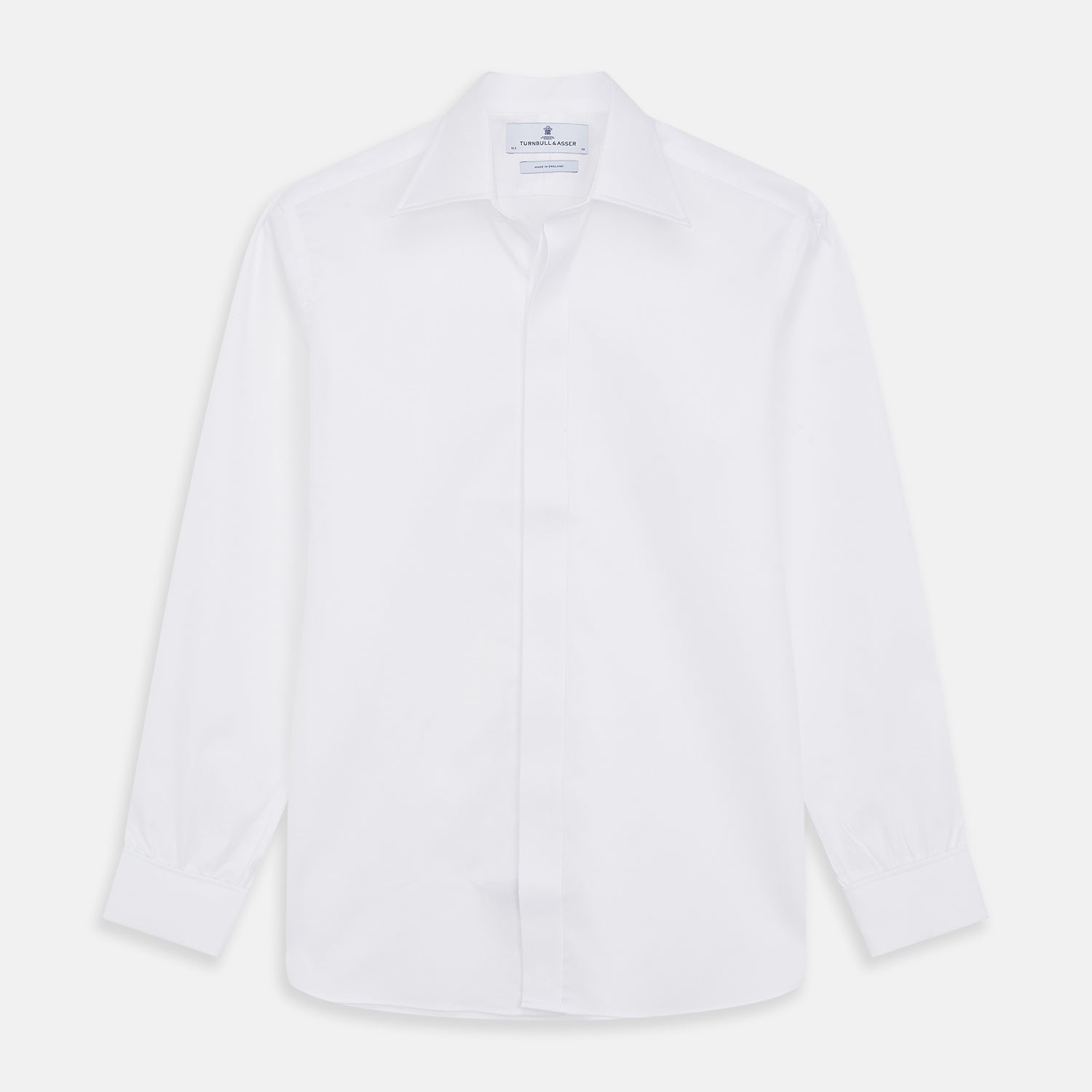 View 1 of product The Turnbull & Asser White Tailored Fit Dress Shirt, featuring a classic collar and button cuffs, is neatly displayed against a white background—perfect as a black tie shirt for formal occasions.